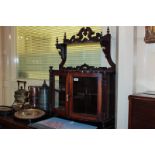 A Victorian walnut wall cabinet with two bow fronted glazed doors and shelf above, 65cm