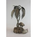 An Elkington and Co table centrepiece modelled as an ostrich under a palm tree, on naturalistic