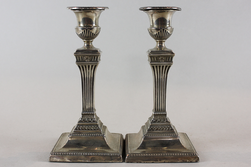 A pair of Victorian silver candlesticks, maker Charles Boyton London 1896, with threaded square