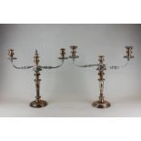 A pair of 19th century Sheffield plated three-light candelabra with scroll shaped branches and