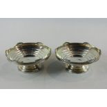 A pair of small silver bonbon bowls, maker R and D Birmingham 1937, with tiered bowls on stemmed