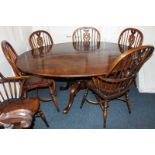 A set of six Windsor dining chairs (two carvers and four single) with arch backs, fretted splats and