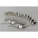 Fourteen early 19th century silver Old English pattern dessert spoons, various dates and makers (