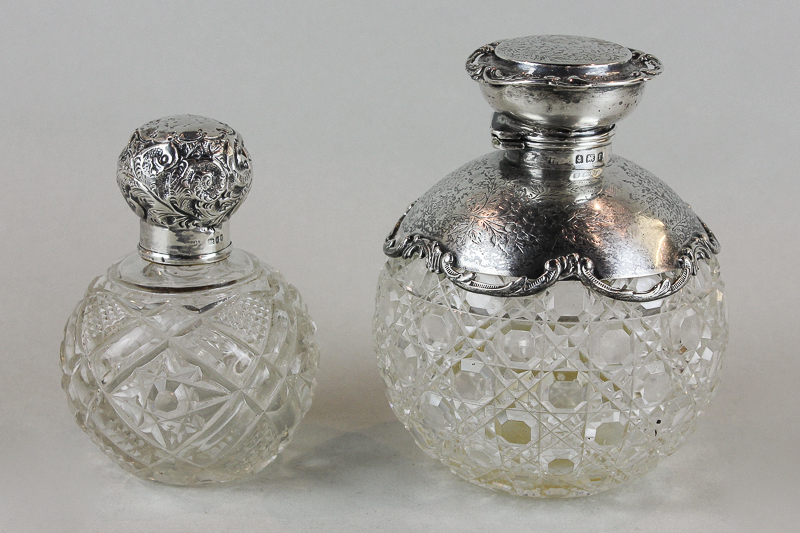 An Edwardian silver top scent bottle with hinged top and hobnail cut glass body, together with a