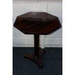 An early 19th century rosewood pedestal table with octagonal top and tapered column on flat tripod