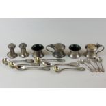 A six-piece silver condiment set of two salts, two peppers and two mustards with four salt spoons,