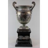 A good silver heavy silver trophy cup with two side scroll and swan handles, maker Elkington and