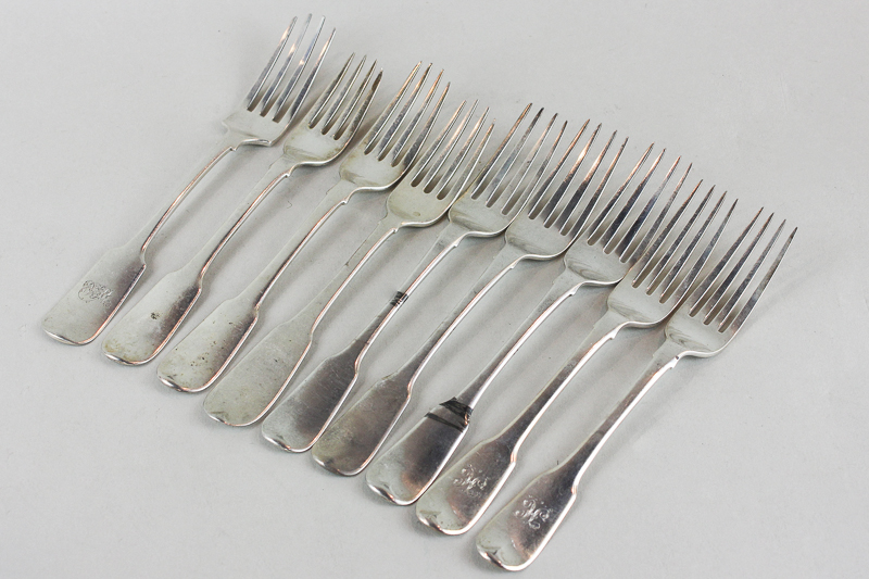 Nine early 19th century silver fiddle pattern table forks, various dates and makers (five