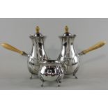 An Edwardian three-piece silver cafe au lait set, maker George Howson London 1907, with pear