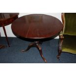 A George III mahogany tea table with circular tilting top on turned column and tripod base, 90cm