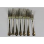 A set of six Edwardian Old English pattern silver dessert forks, London 1906, 10oz, and one plated