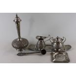 A Persian engraved decorated 'bottle vase' with lid, a cream jug and sugar bowl, small tray, ashtray