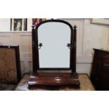 A Victorian mahogany swing mirror with two candle branches above serpentine 'box' base, 71cm