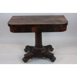 An early Victorian rosewood card table with folding rectangular swivel top, on octagonal column