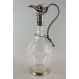 A late Victorian/Edwardian glass claret jug with 'rope'  handle and hinged lid, the glass body
