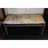 A mottled marble top rectangular coffee table with part gilt gallery top on four turned legs,