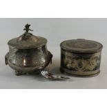 A Victorian plated tea caddy with bird finial and squat oval body and another oval engraved tea