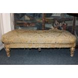 A Regency gilt framed stool on four short turned legs, 116cm by 70cm (NC)