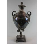 A Victorian plated samovar, urn shaped with foliate handles on square base, height 55cm (NC)