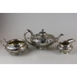 A Victorian silver three-piece tea set, maker William Moulson 1847/8/9, with circular flower and