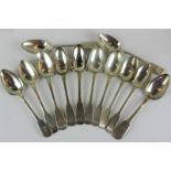 Twelve early 19th century silver fiddle pattern dessert spoons, various dates and makers (five
