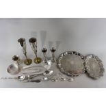 A collection of plated items to include circular tray, soup ladle, biscuit holder, place mats, etc