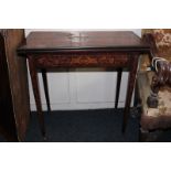 A 19th century Dutch marquetry card table with rectangular folding top on four square legs,