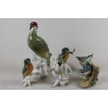 A Karl Ens Dresden porcelain model of a green woodpecker, two kingfishers, nuthatch, crested tit and