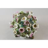 A Victorian floral encrusted porcelain vase, globular form with pink and white flowers, 18cm