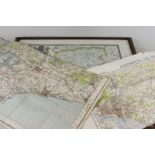 A reproduction of Saxton's Map of Hampshire, framed, 48cm by 55cm, and two linen backed Ordnance