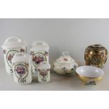 A set of four ceramic storage jars, graduating sizes, decorated with floral bouquets, Sucre, Farine,