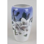 A Royal Copenhagen porcelain vase decorated with lilies, 19cm high