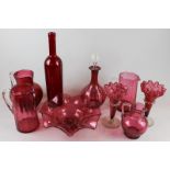 A collection of Victorian and later cranberry glass ware to included bowl, pair of bud vases, four