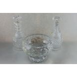 A pair of cut glass spirit decanters with hobnail cut bodies and stepped necks, with mushroom