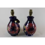 Moorcroft, a pair of anemone decorated table lamps