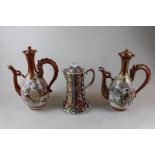 A pair of Japanese Kutani porcelain jugs and covers, baluster shape with dragon handles, 30cm