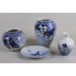 Royal Copenhagen porcelain, three various vases and a small oval dish decorated with butterflies,