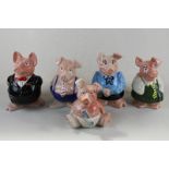 A set of five Wade pig Nat West money boxes