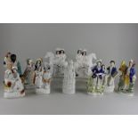 Nine Staffordshire figures including a pair of a couple on a white horse, man with parrot, Scot with