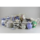 A collection of twelve Victorian and later jugs, vases and teapots