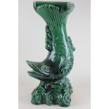 A green ceramic jardiniere stand with support in the form of a fish, 57cm high