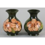 A pair of Moorcroft hibiscus vases in green and peach colourway, 13cm high