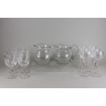 A set of six cut glass hock glasses, six wine glasses and two cut glass jugs