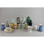 A collection of Victorian and later porcelain vases including a pair of blue glazed vases, moulded