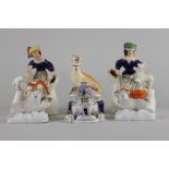 A pair of Staffordshire figure spill vases, 15cm, a figure of a greyhound, two sheep and a cottage