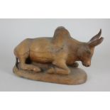 A carved wooden figure of an oxen, 33cm (NC)