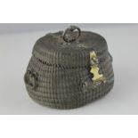 An oriental white metal wire basket oval shaped with hinged lid fitted handles and catch, 9.5cm wide