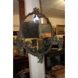 A 19th century ornate gilt framed girandole mirror, the circular plate in ribbon crested frame