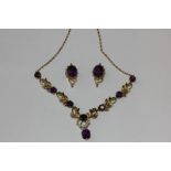 An amethyst and pearl necklace and a pair of similar ear clips