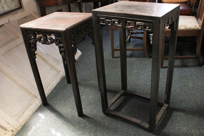 A Chinese rosewood occasional table with pierced support on turned legs, 72cm high, and another